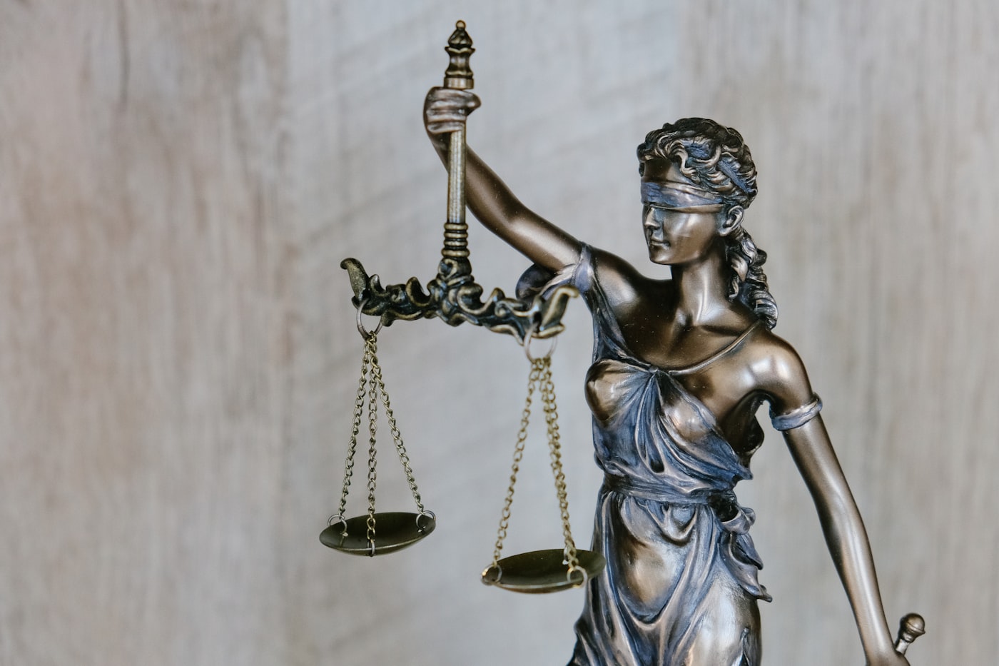 Lady Justice statue holding balanced scales